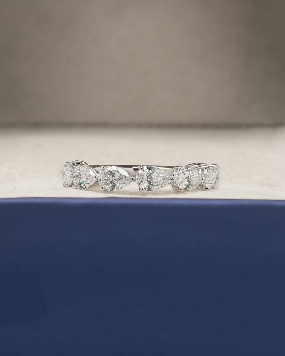 Sylvie pear lab grown diamond eternity band in white gold inside Ronora box