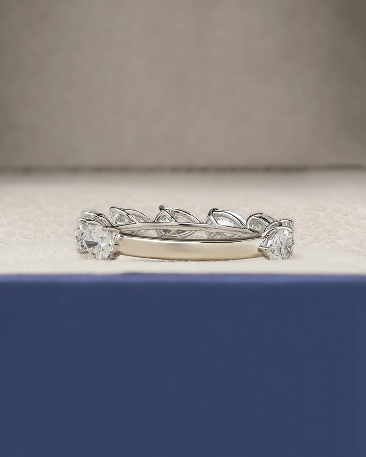 Side profile of pear lab grown diamond eternity band showing ring setting