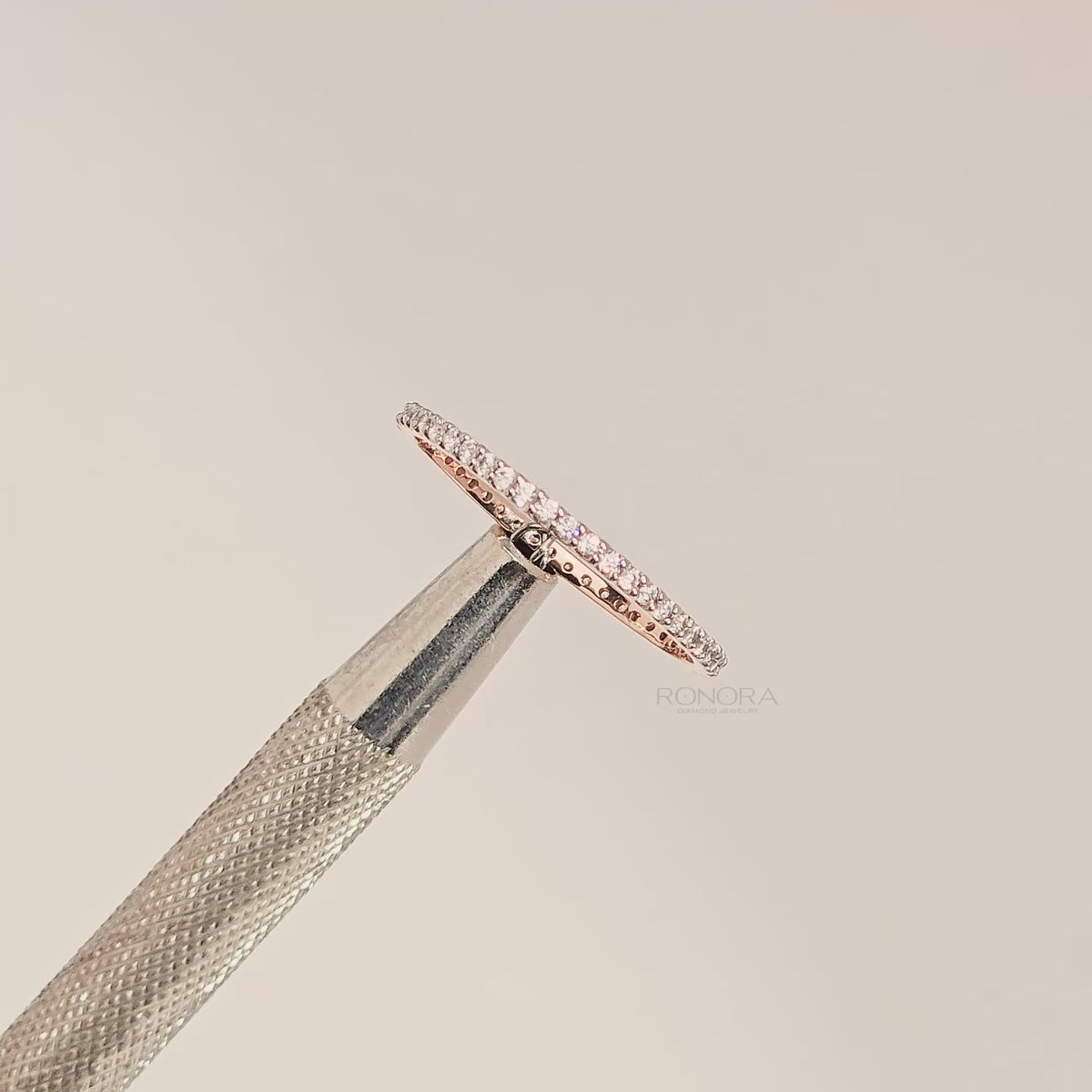 Close-up video of slim rose gold lab grown diamond pavé eternity band