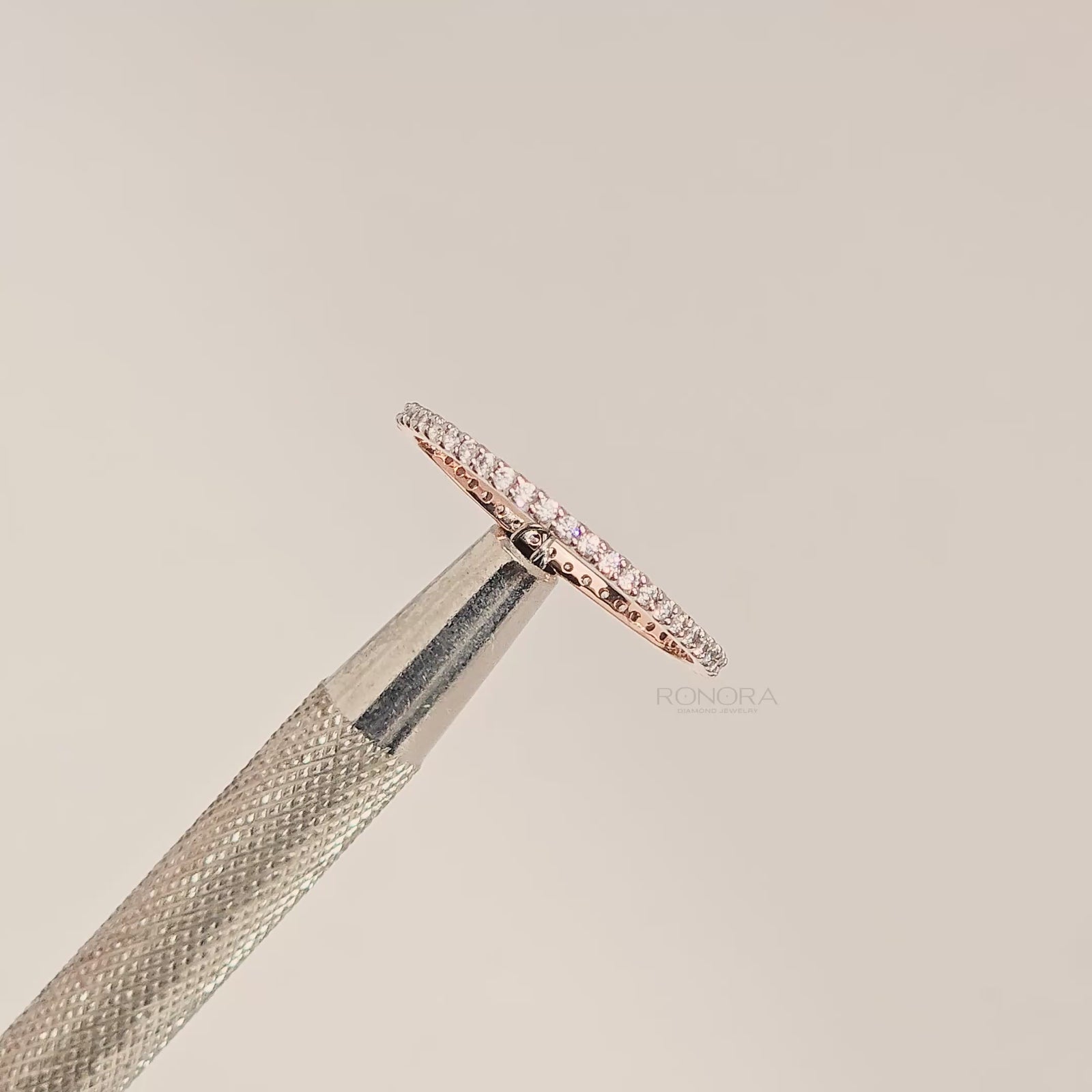 Close-up video of slim rose gold lab grown diamond pavé eternity band