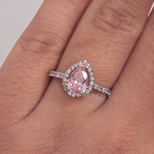 Close-up video of pink pear moissanite halo ring in rose gold