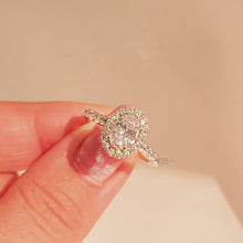 Close-up video of oval moissanite halo ring in rose gold