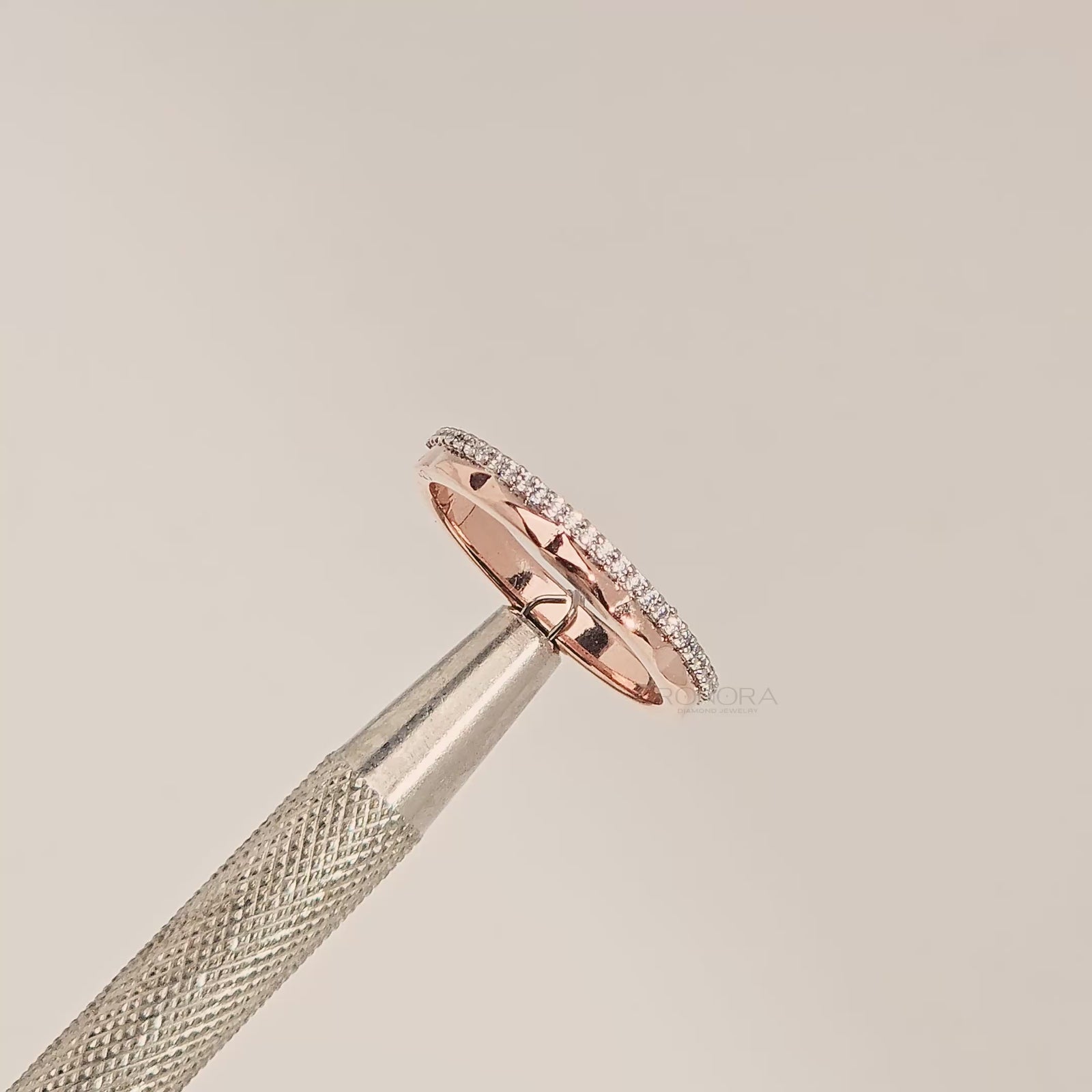 Close-up video of split rose gold lab grown diamond pavé band