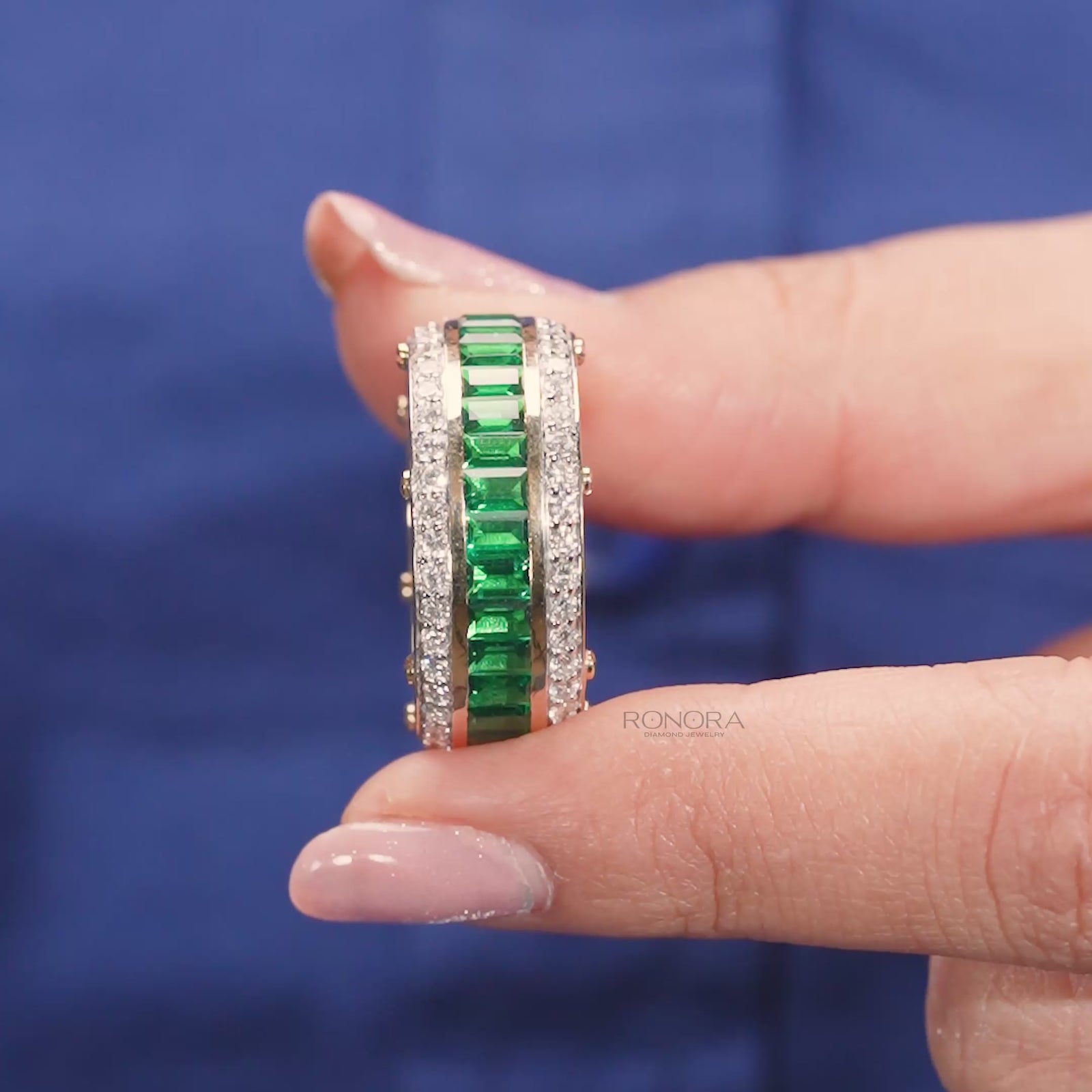 Close-up video of green lab grown diamond channel band in yellow gold