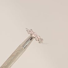 Close-up video of round lab grown diamond five-stone band in white metal