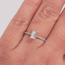 Close-up video of emerald cut moissanite pave ring in rose gold