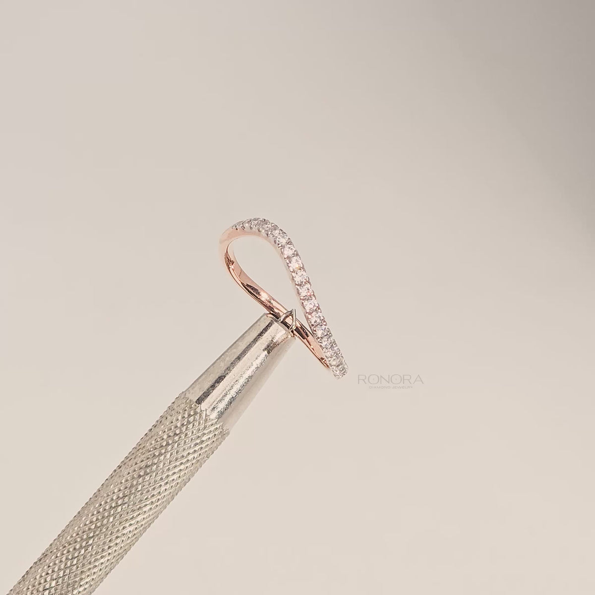 Close-up video of slim rose gold curved lab grown diamond pavé band