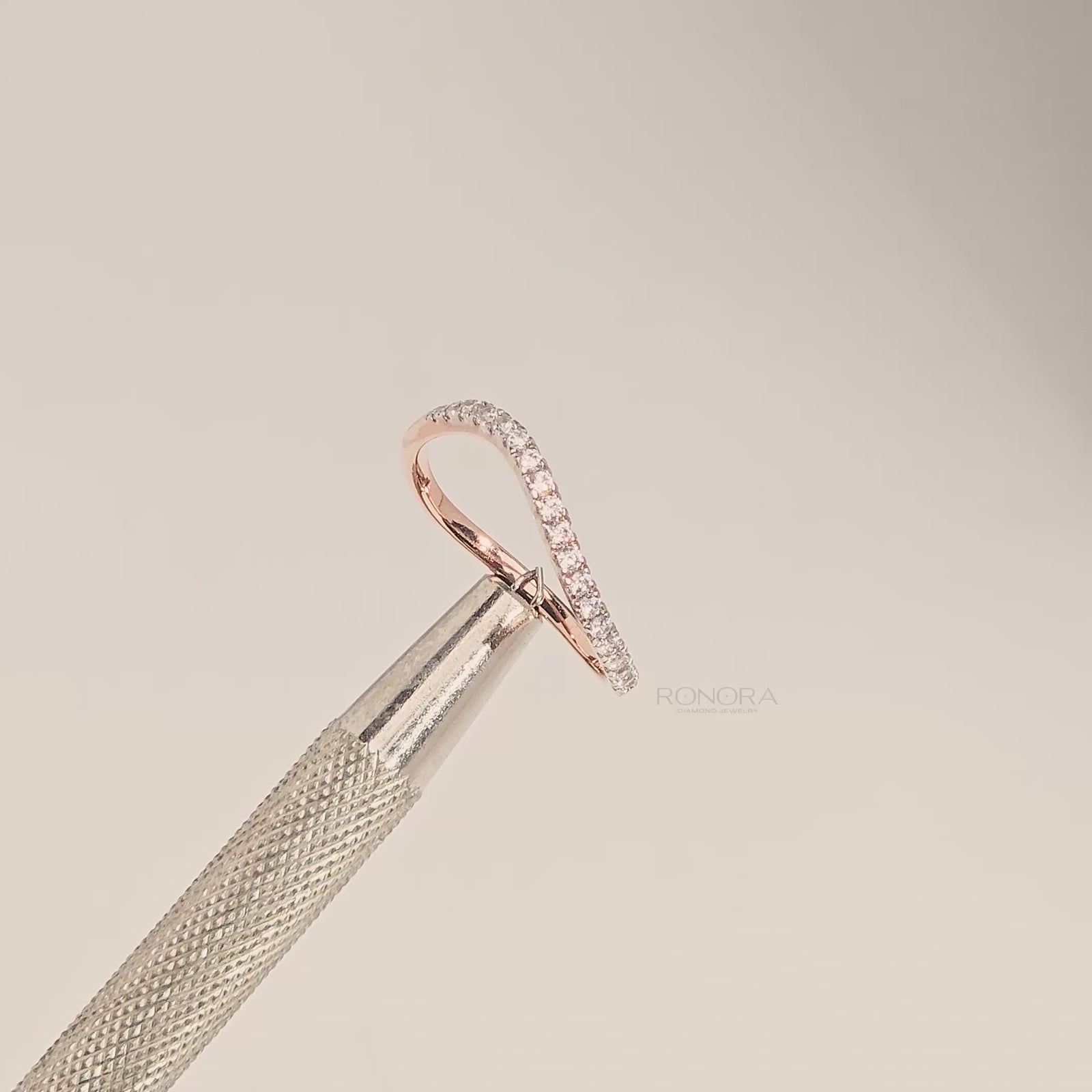 Close-up video of slim rose gold curved lab grown diamond pavé band