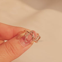 Close-up video of open lab grown diamond geometric ring in rose gold