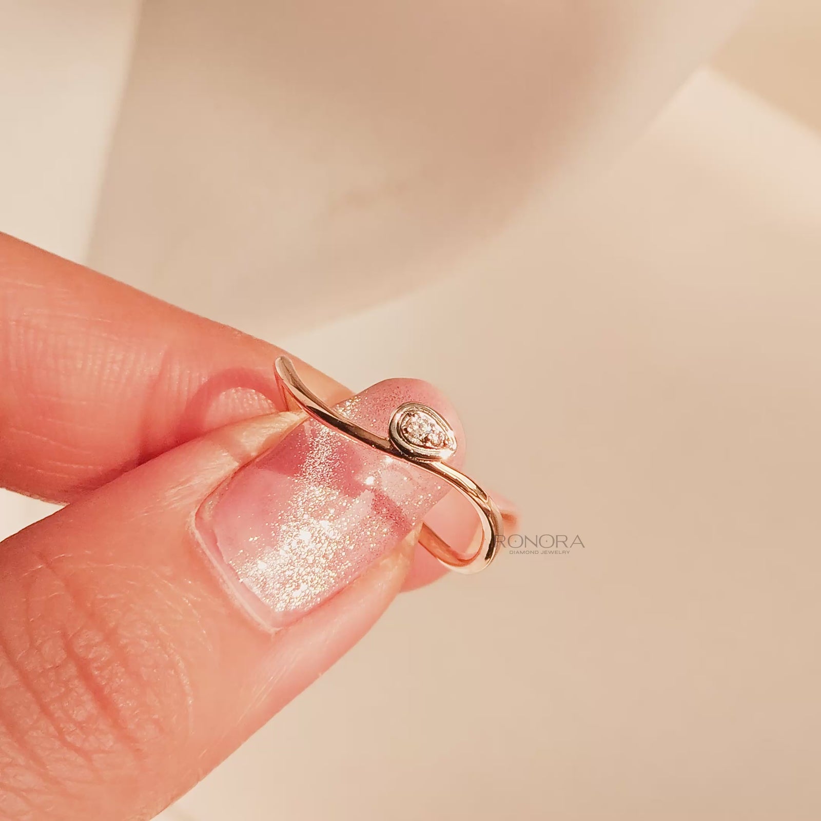 Close-up video of round lab grown diamond solitaire ring in rose gold