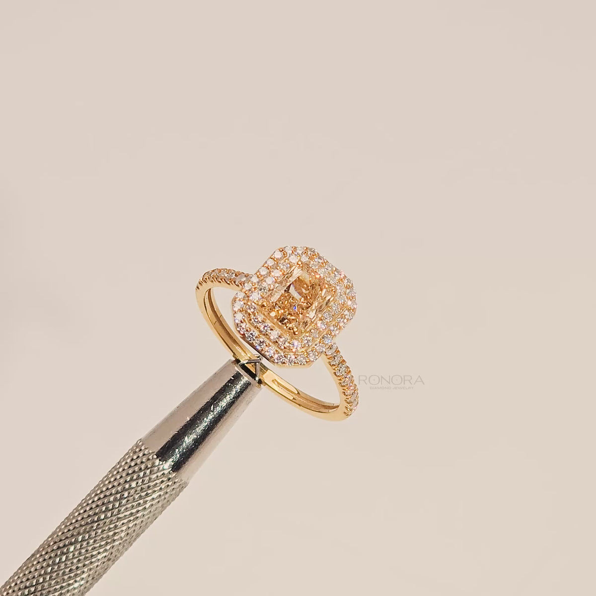 Close-up video of yellow radiant lab grown diamond halo ring in yellow gold