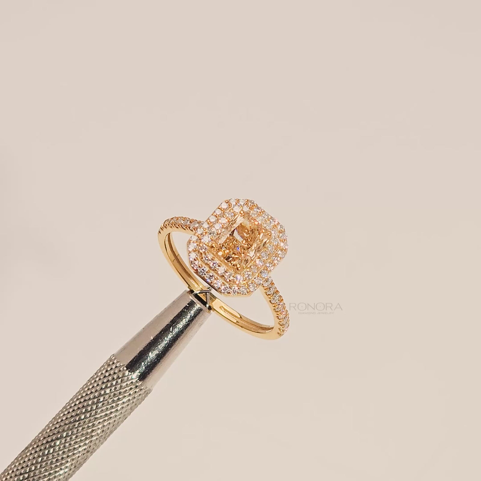Close-up video of yellow radiant lab grown diamond halo ring in yellow gold