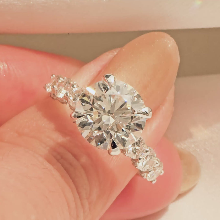 Close-up video of round lab grown diamond vintage halo ring in yellow gold