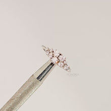 Close-up video of floral lab grown diamond cluster ring in white metal