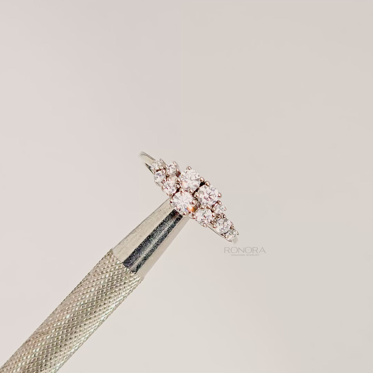 Close-up video of floral lab grown diamond cluster ring in white metal