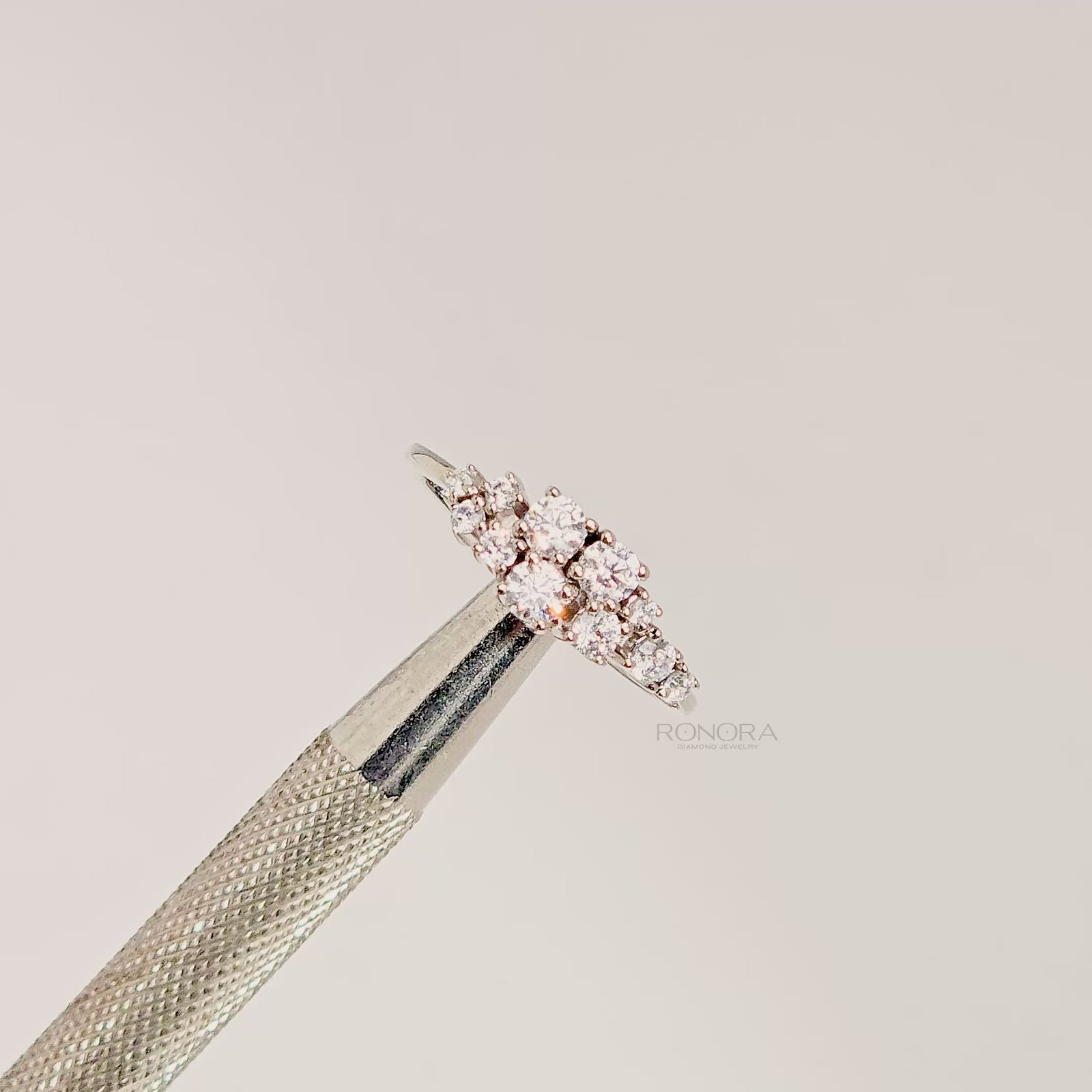 Close-up video of floral lab grown diamond cluster ring in white metal