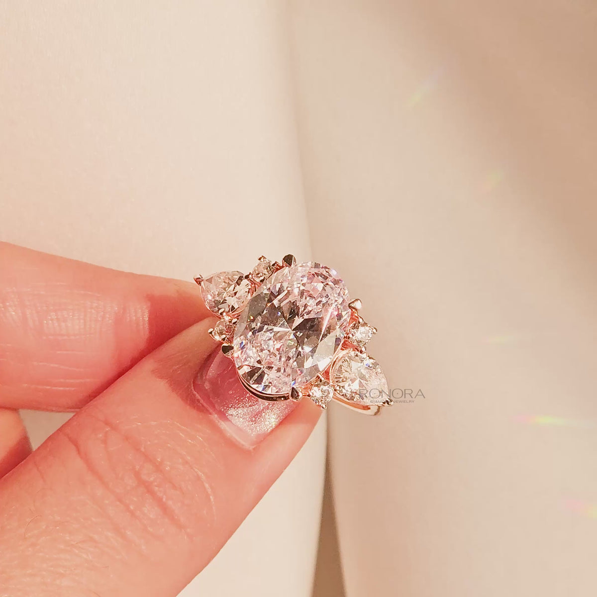 Close-up video of oval moissanite three-stone ring with side stones