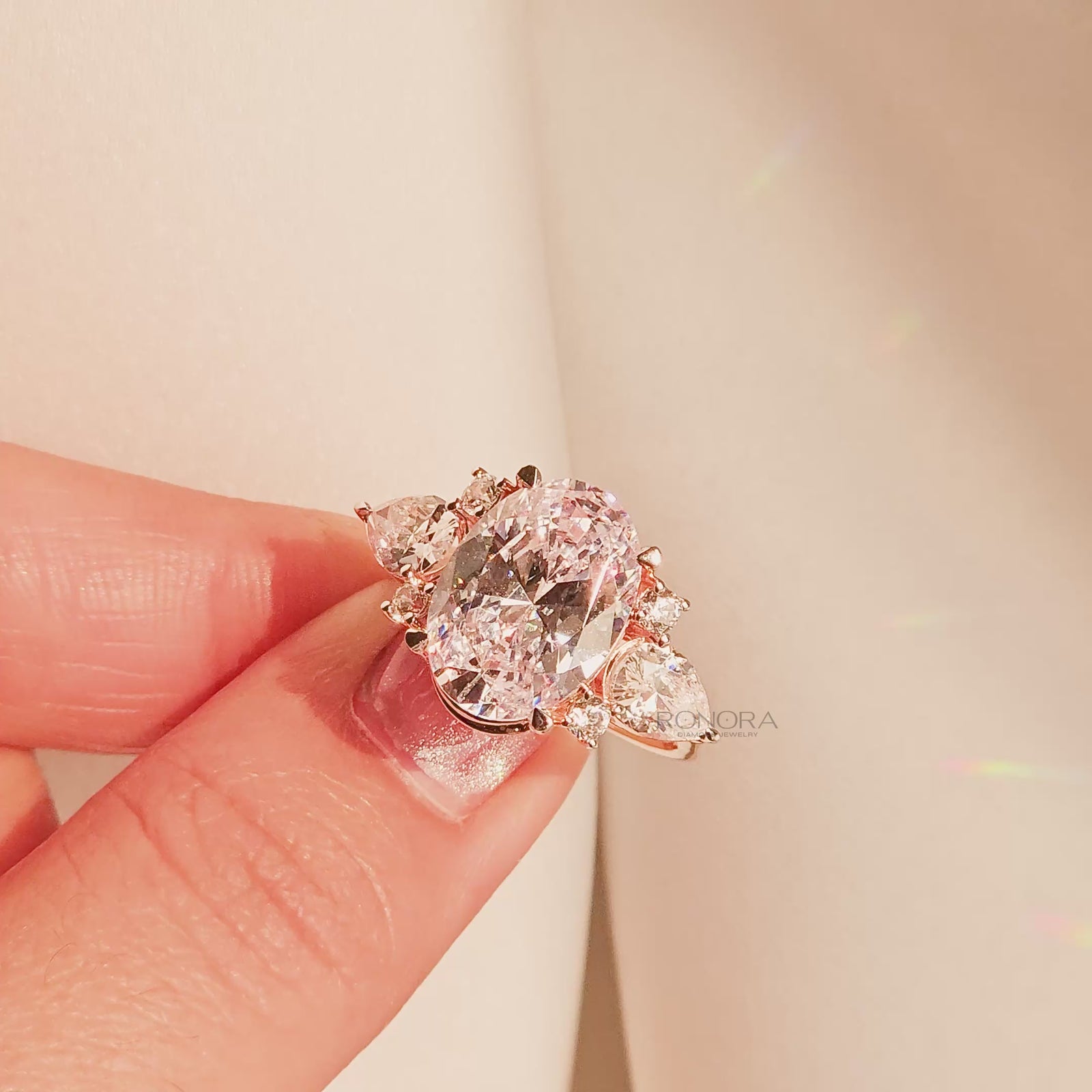 Close-up video of oval moissanite three-stone ring with side stones