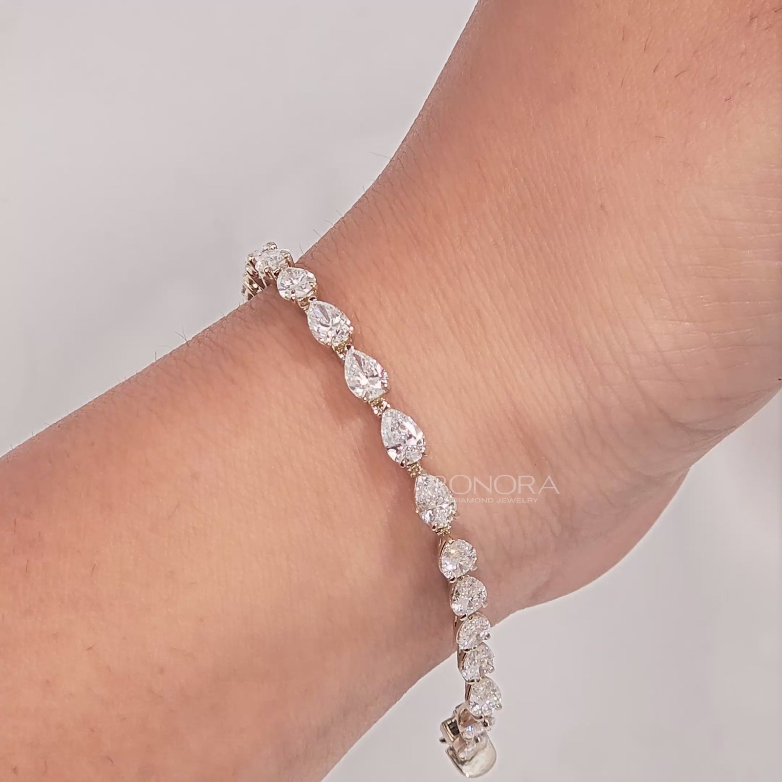 Video of pear lab grown diamond tennis bracelet on wrist