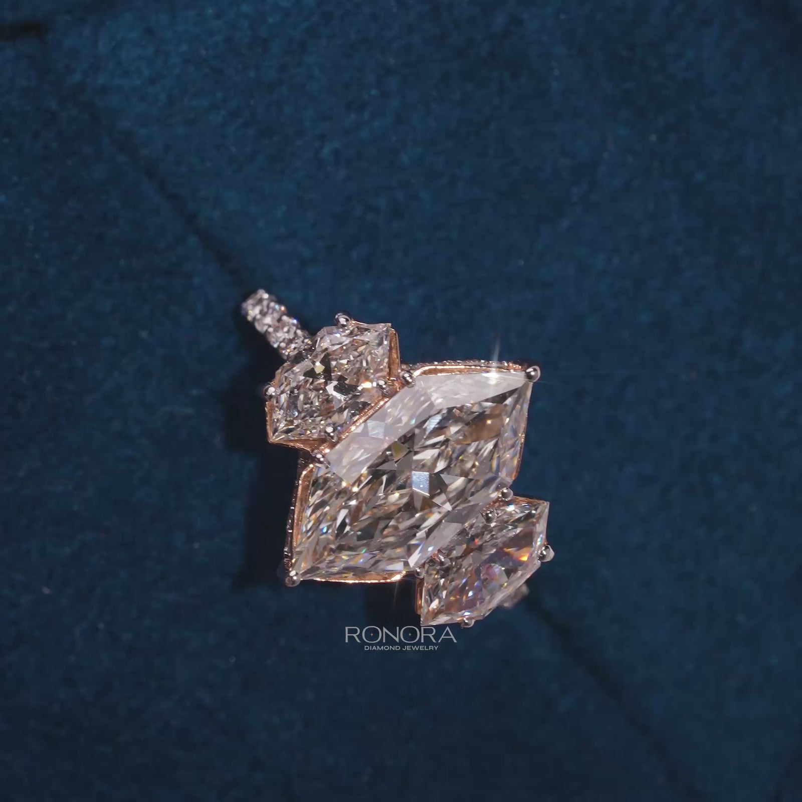 Close-up video of marquise lab grown diamond three-stone ring in white gold