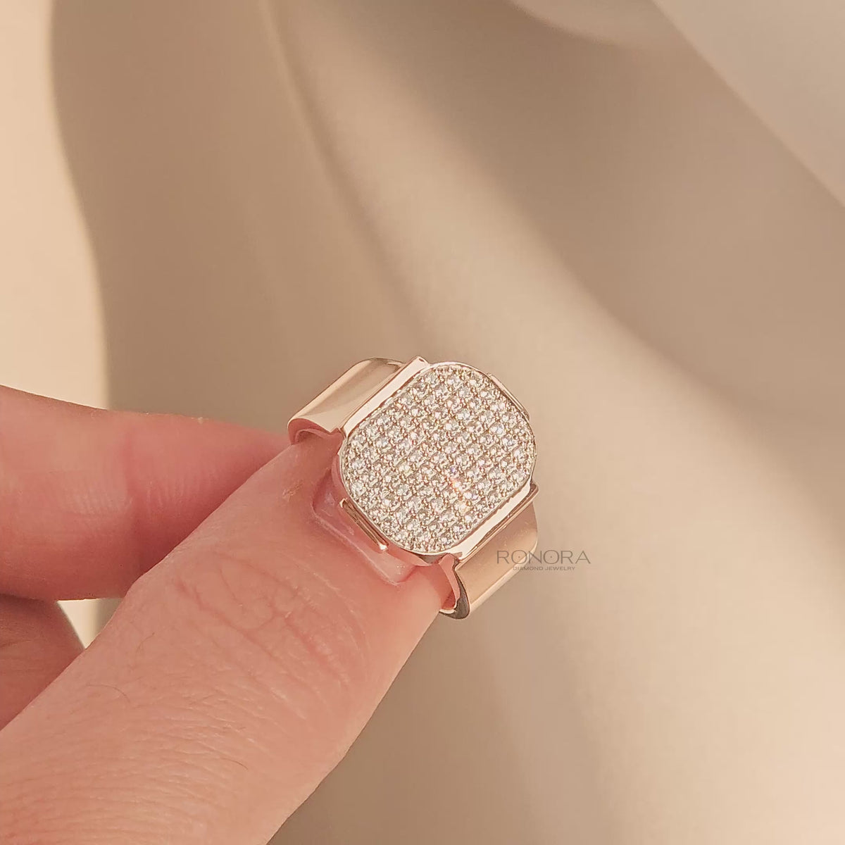 Close-up video of square lab grown diamond pavé signet ring in rose gold