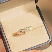 Close-up video of round lab grown diamond three-stone ring in rose gold