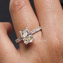 Close-up video of radiant lab grown diamond pavé ring in yellow gold