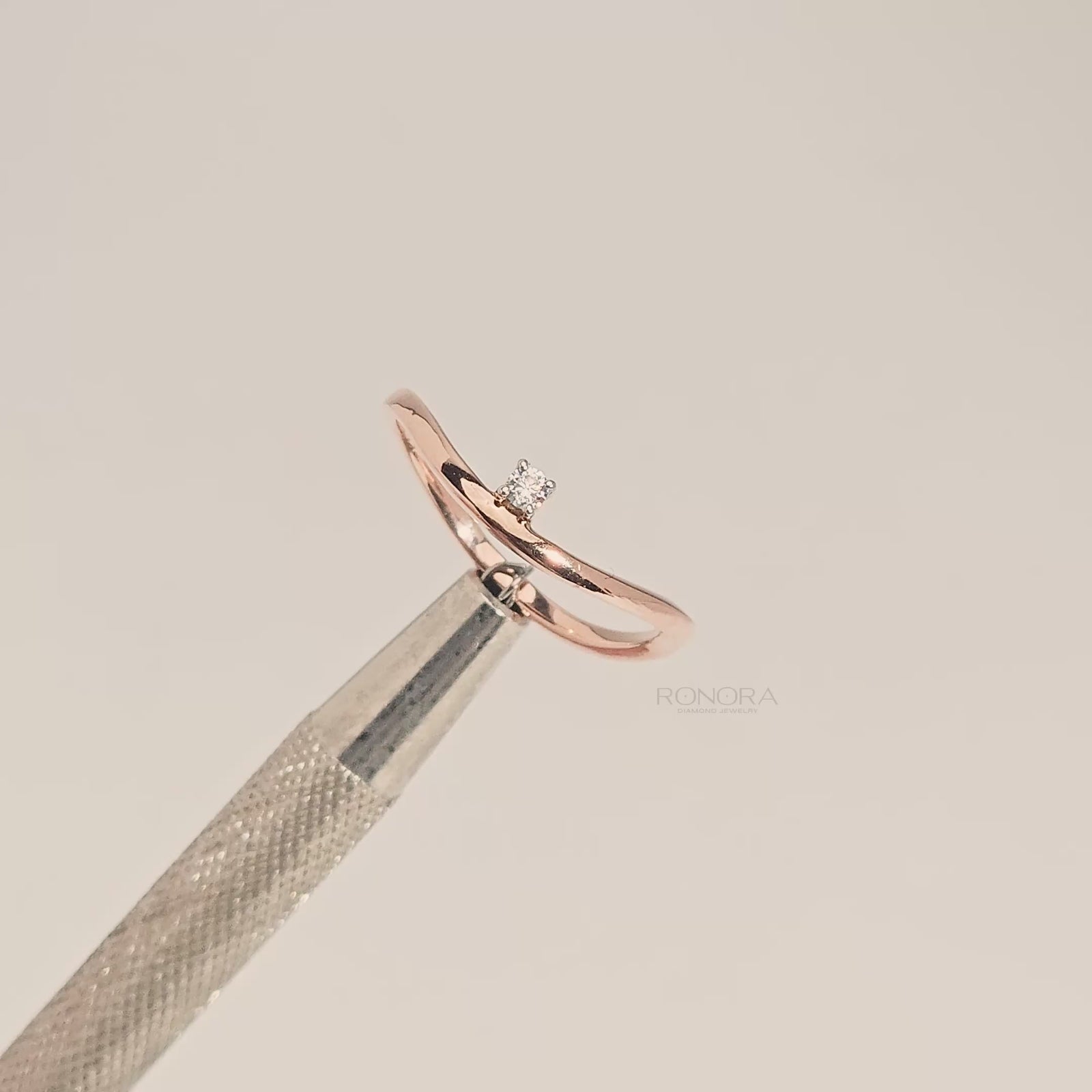 Close-up video of minimal round lab grown diamond solitaire ring in rose gold