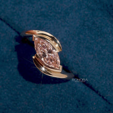 Close-up video of pink marquise lab grown diamond twist ring in rose gold
