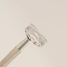Close-up video of four-band lab grown diamond pavé crossover ring