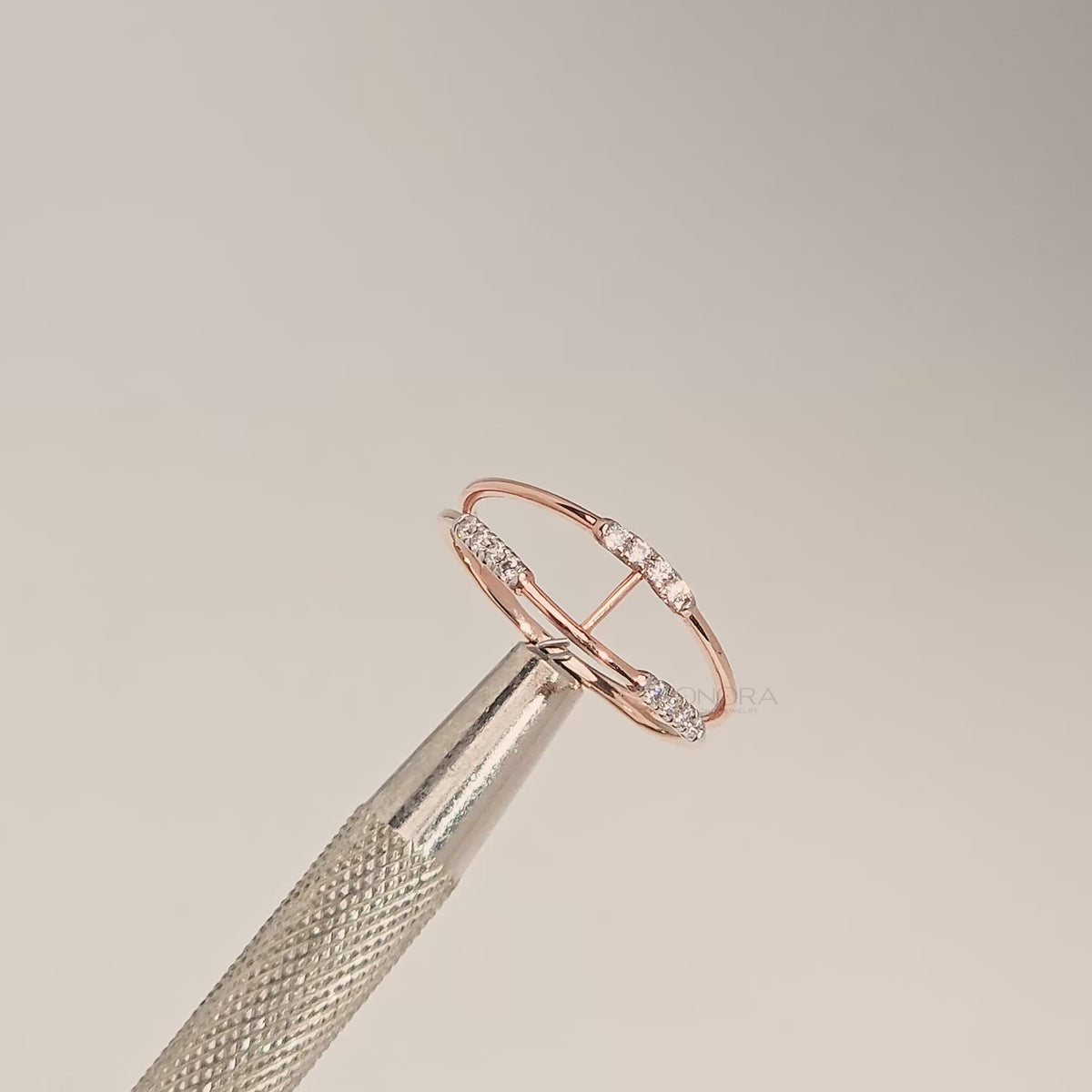 Close-up video of open rose gold lab grown diamond bypass ring