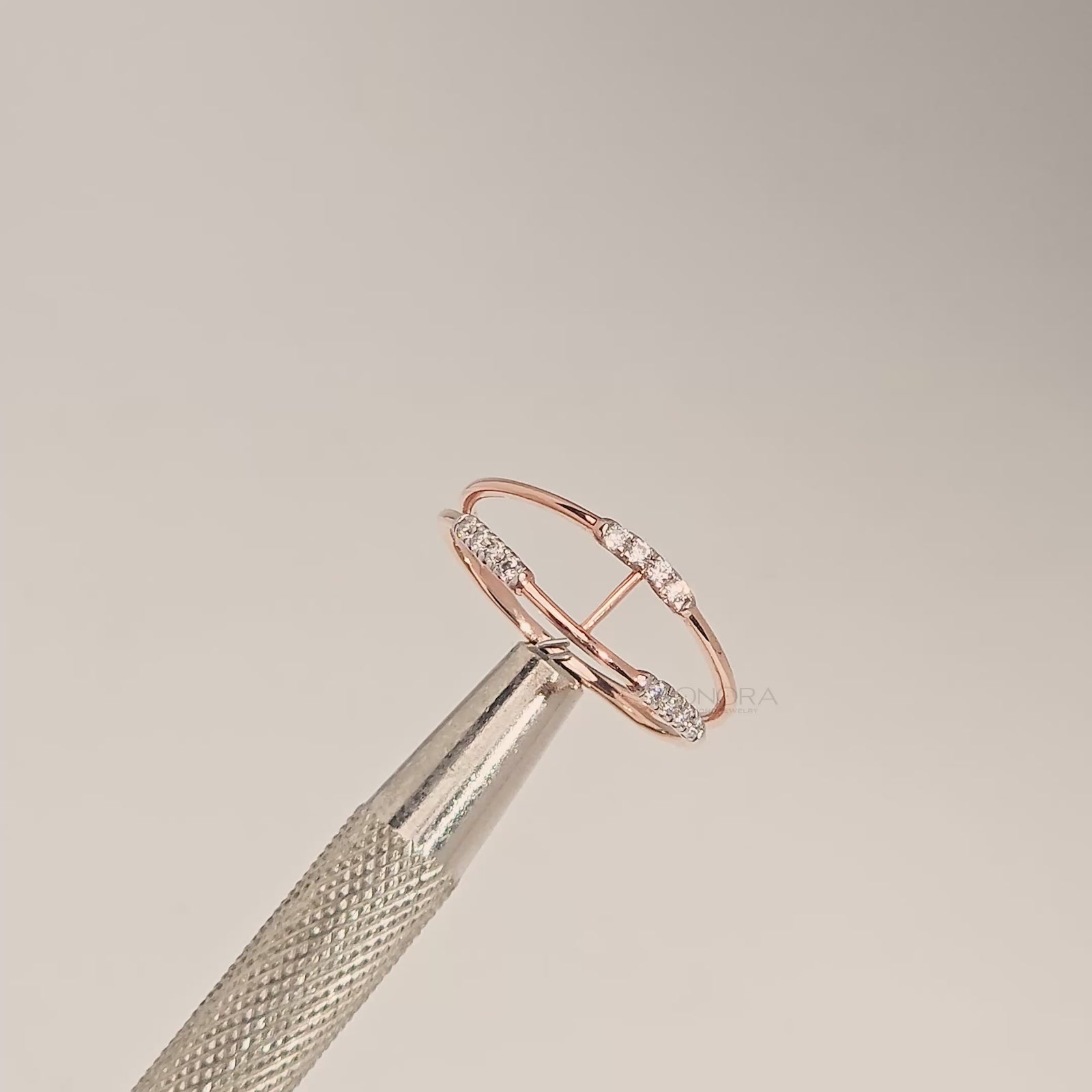 Close-up video of open rose gold lab grown diamond bypass ring