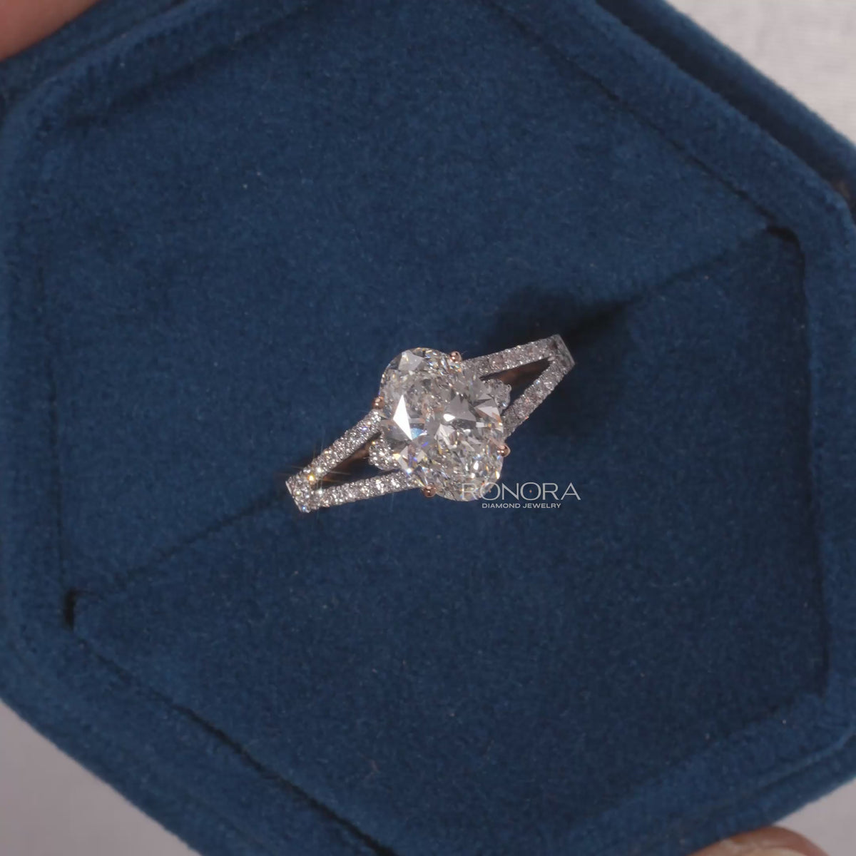 Close-up video of oval lab grown diamond halo ring in white gold
