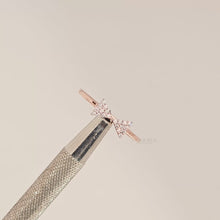 Close-up video of rose gold pavé bow lab grown diamond ring