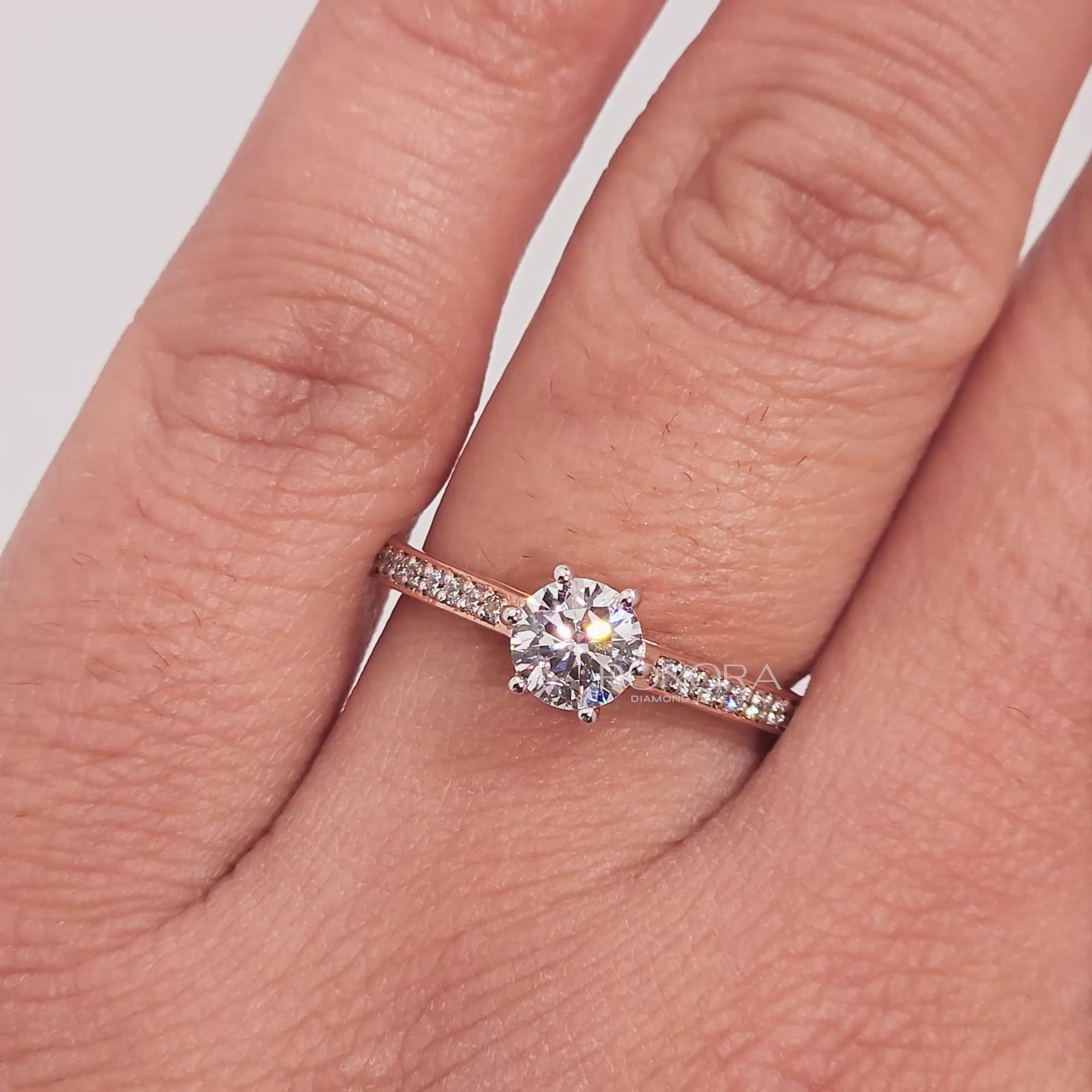 Close-up video of round moissanite pave ring in rose gold