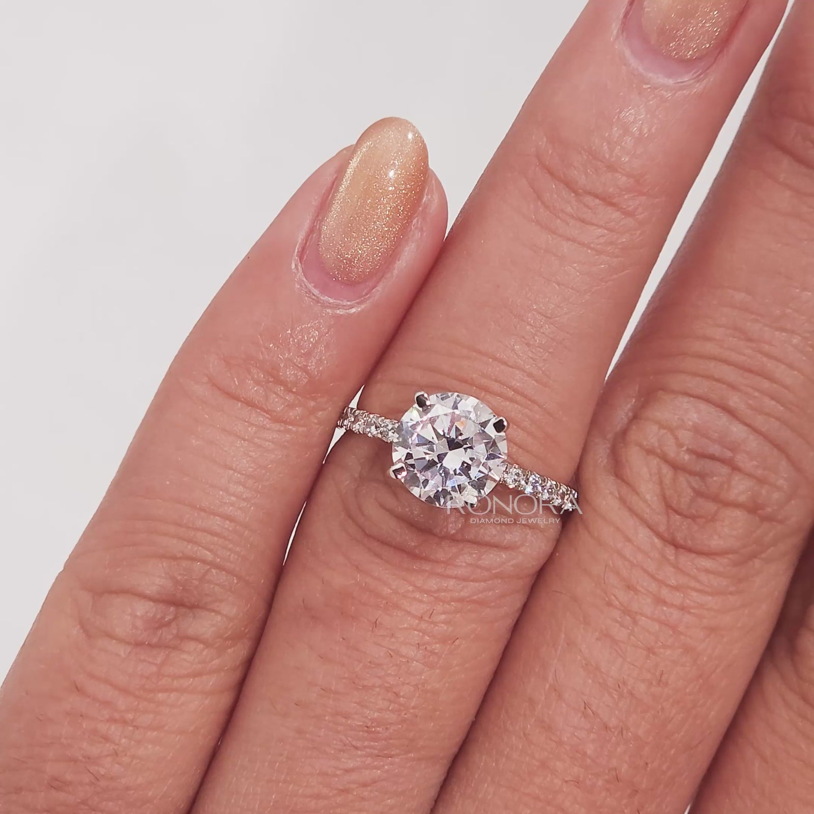 Close-up video of round moissanite pave ring in rose gold