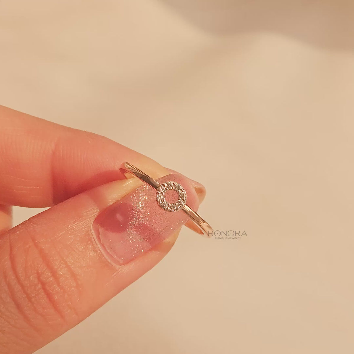 Close-up video of round lab grown diamond halo ring in rose gold