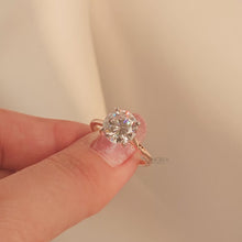 Close-up video of round moissanite solitaire ring in rose gold