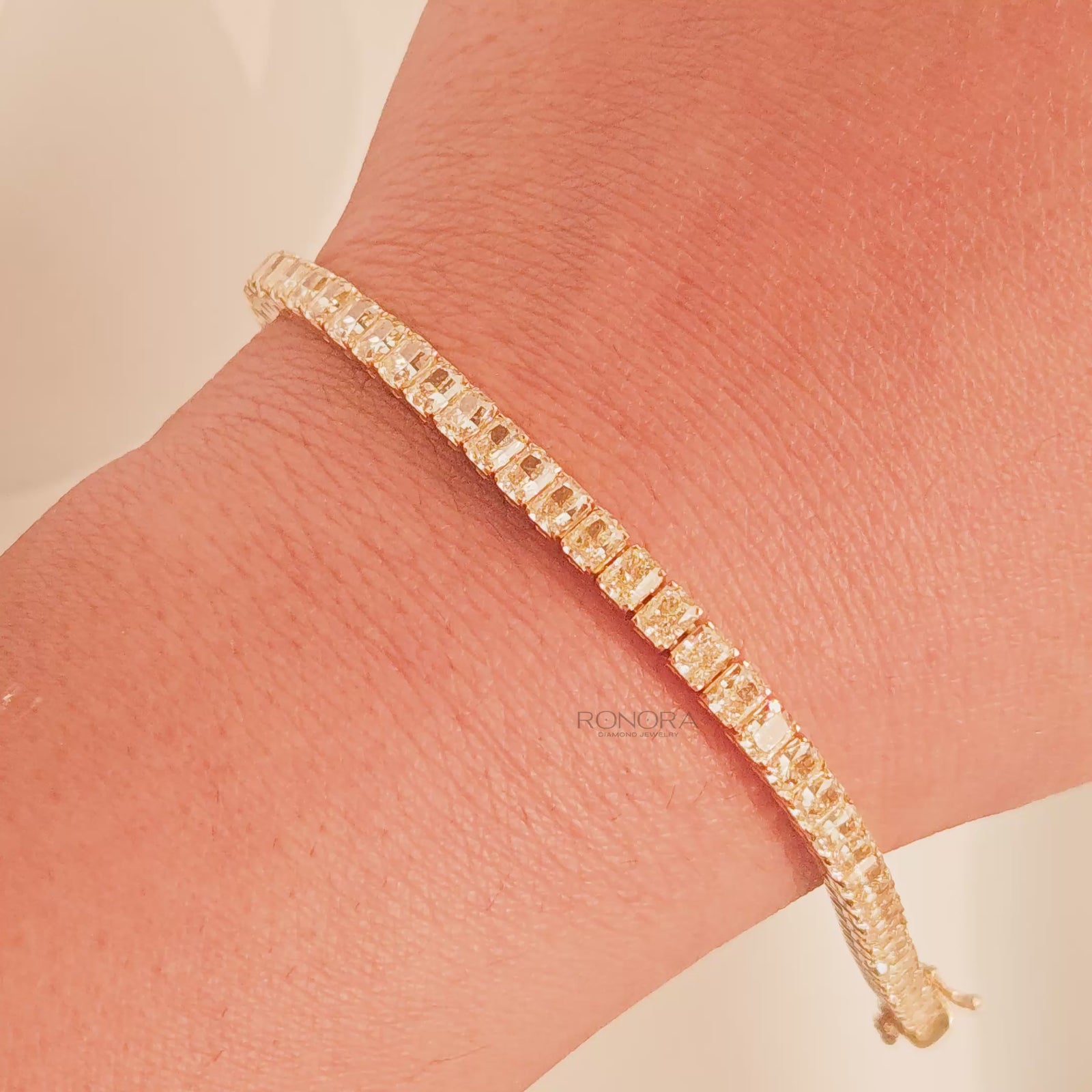 Video of radiant yellow lab grown diamond tennis bracelet on wrist