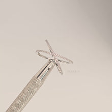 Close-up video of white lab grown diamond pavé crossover ring