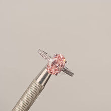 Close-up video of pink oval lab grown diamond halo ring in white gold