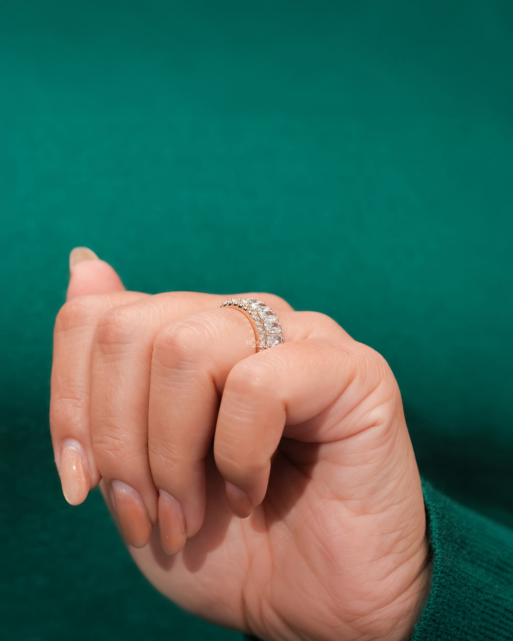 Side profile of radiant lab grown diamond eternity band showing ring setting