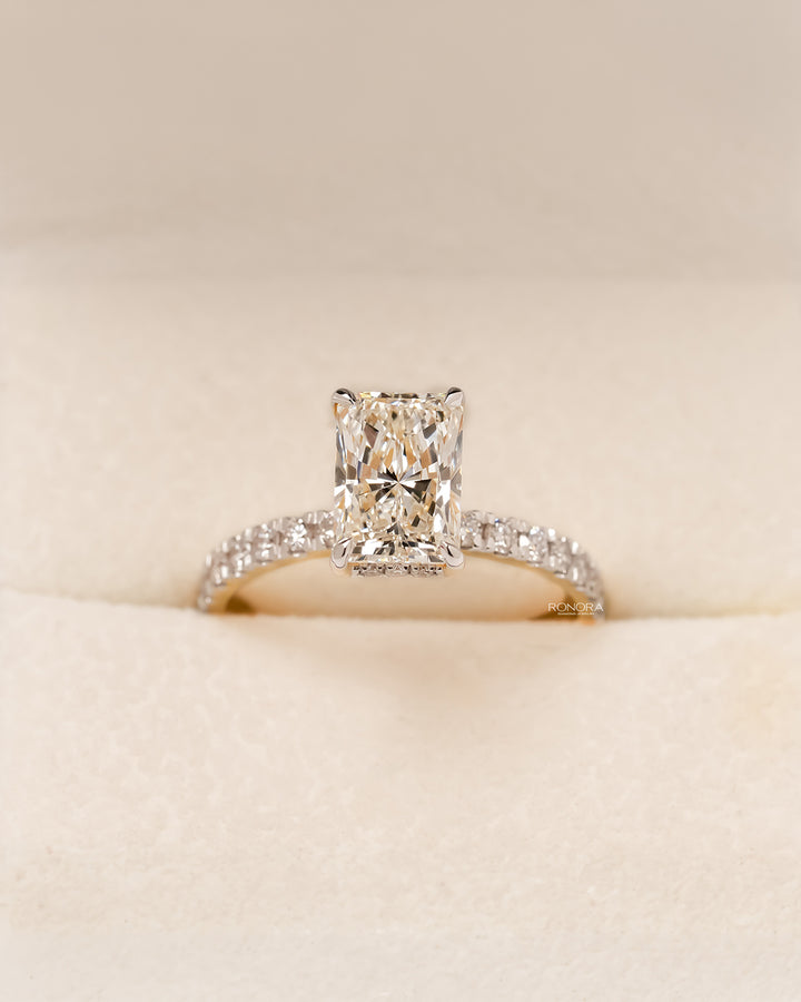 Radiant cut pave lab grown diamond engagement ring in yellow gold inside Ronora box