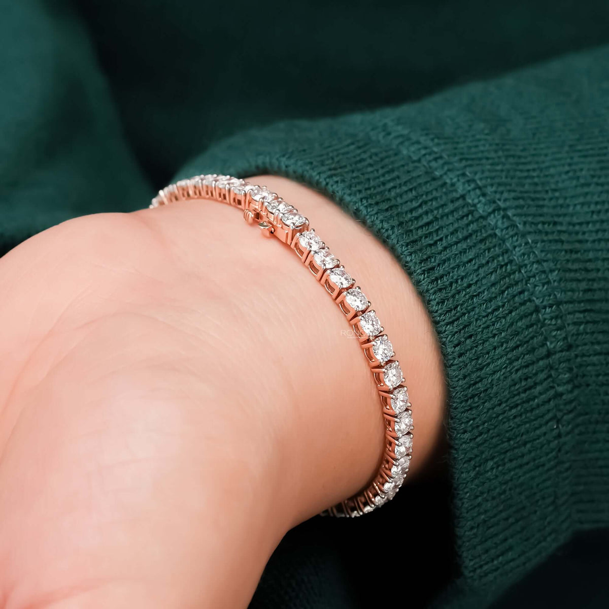 Close-up round lab grown diamond tennis bracelet on wrist