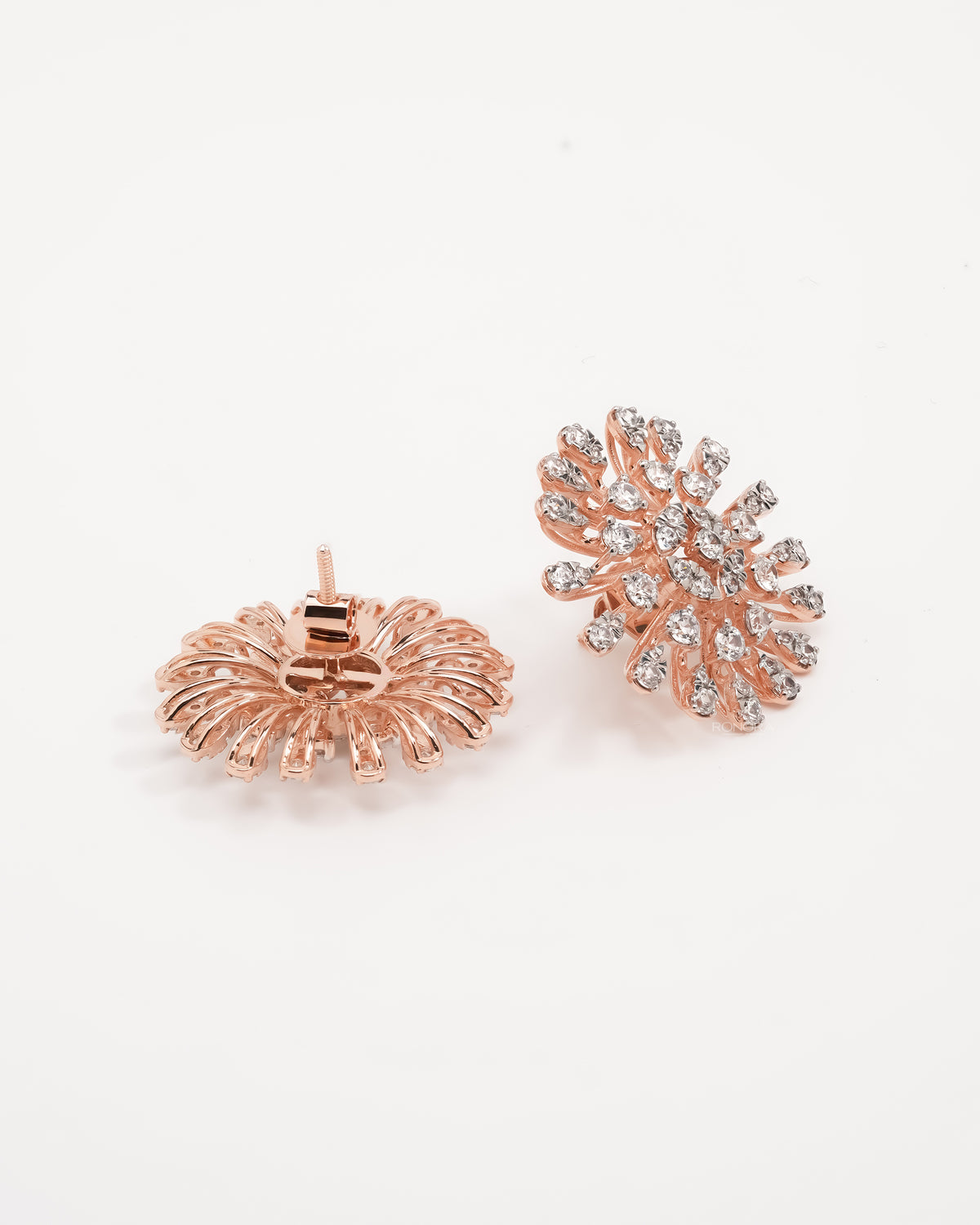 Starburst cluster lab grown diamond earrings in rose gold, one showing the open back, one the front