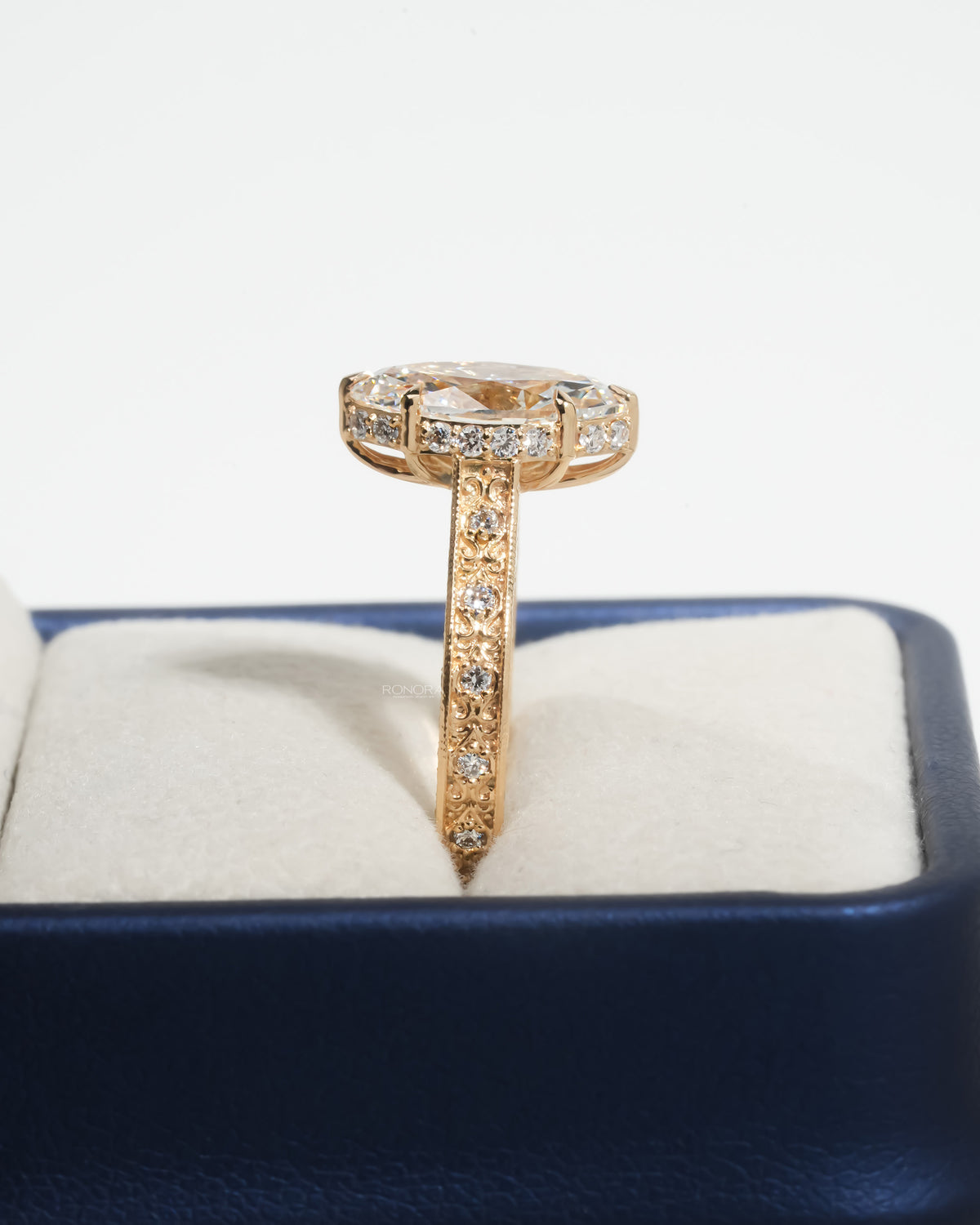 Side profile of the vintage marquise lab grown diamond ring showing the pave gallery
