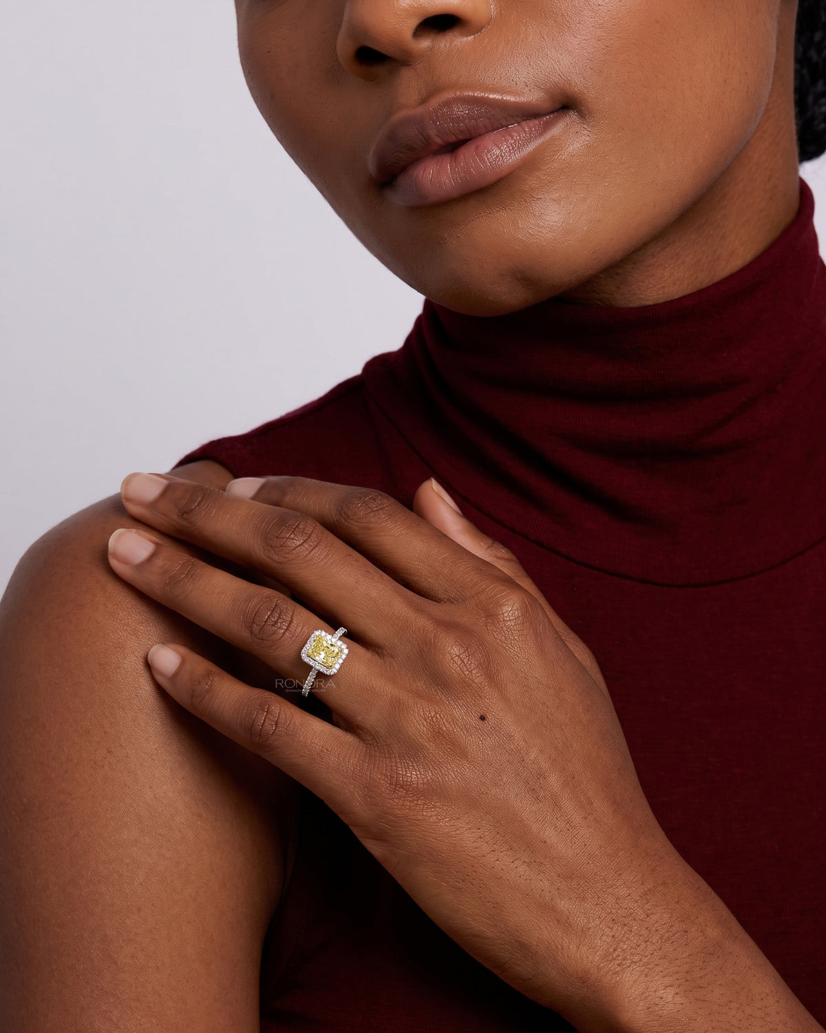 Model wearing the fancy yellow lab grown diamond halo engagement ring
