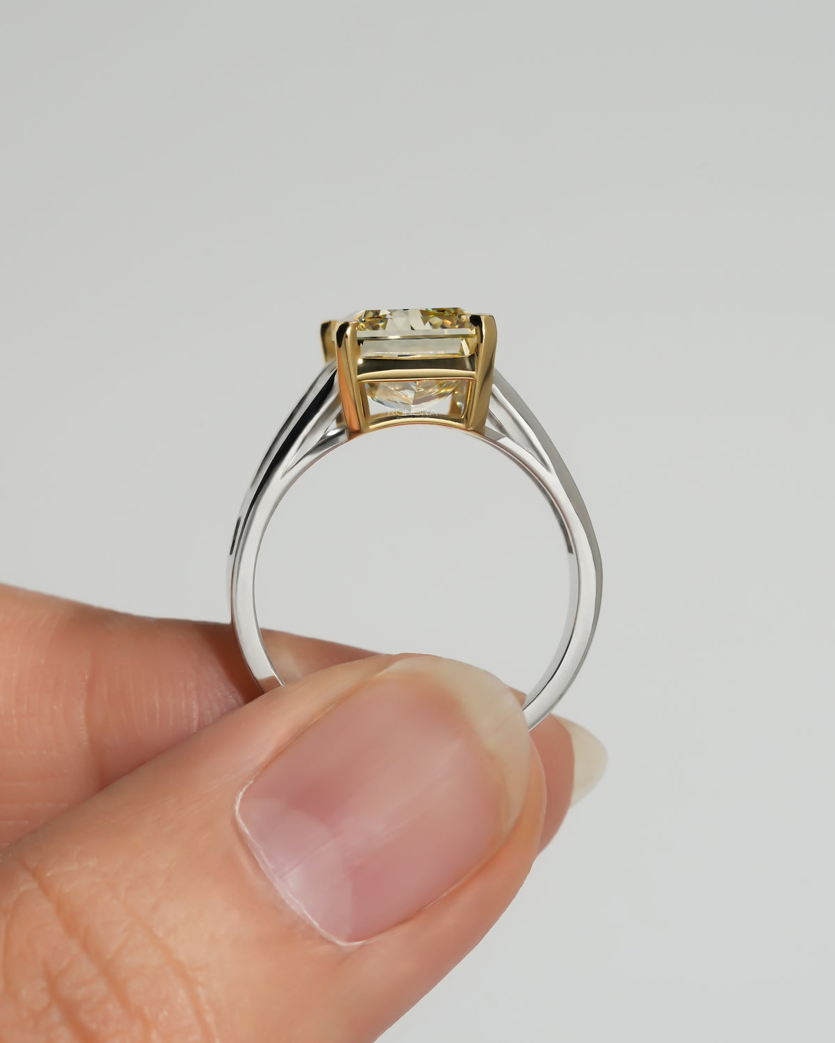 Side profile of the fancy yellow radiant lab grown diamond ring showing the white gold band